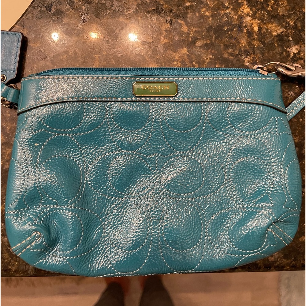Small teal coach clutch